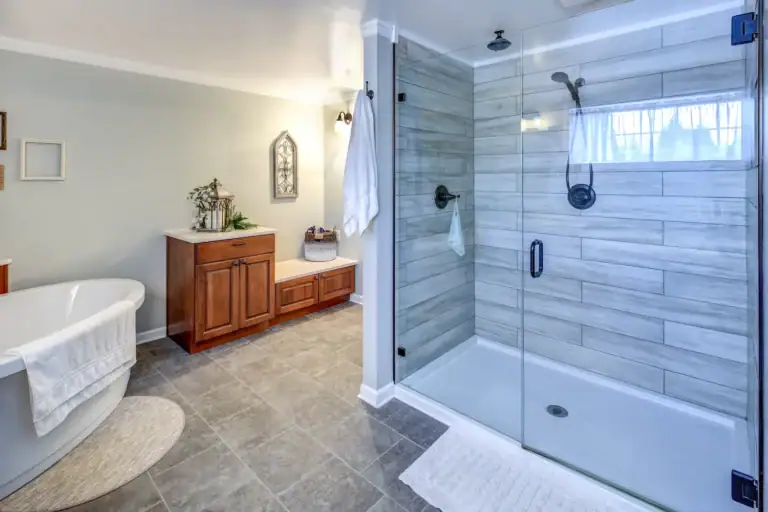 “Luxury bathroom undergoing remodel, featuring a modern spa-like design. The space includes a freestanding bathtub, walk-in shower, updated vanity with sink, contemporary lighting, and elegant tiles, creating a relaxing and stylish environment.”