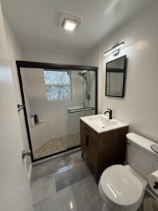 Contemporary bathroom with walk-in shower and vanity.