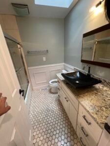 Contemporary bathroom with vessel sink and walk-in shower.