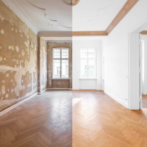 A room with an old, worn left side and a right side featuring newly painted white walls and wood floor.