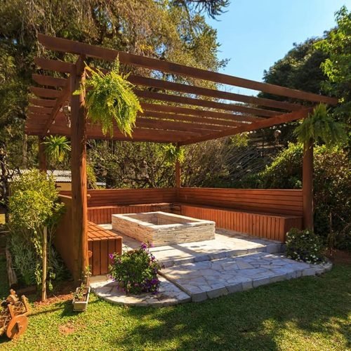 A backyard featuring a wooden pergola providing partial shade over a hot tub. The hot tub is surrounded by decking or patio flooring, and the backyard may include plants, grass, or outdoor furniture. The scene creates a relaxing and inviting outdoor space for leisure and socializing